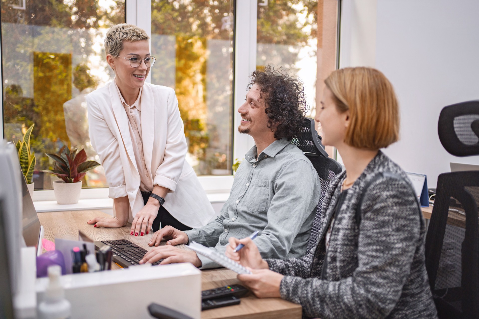 Business team collaborating on a project, discussing strategy in the office